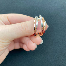 Load image into Gallery viewer, Silver and rose gold crossover hoops

