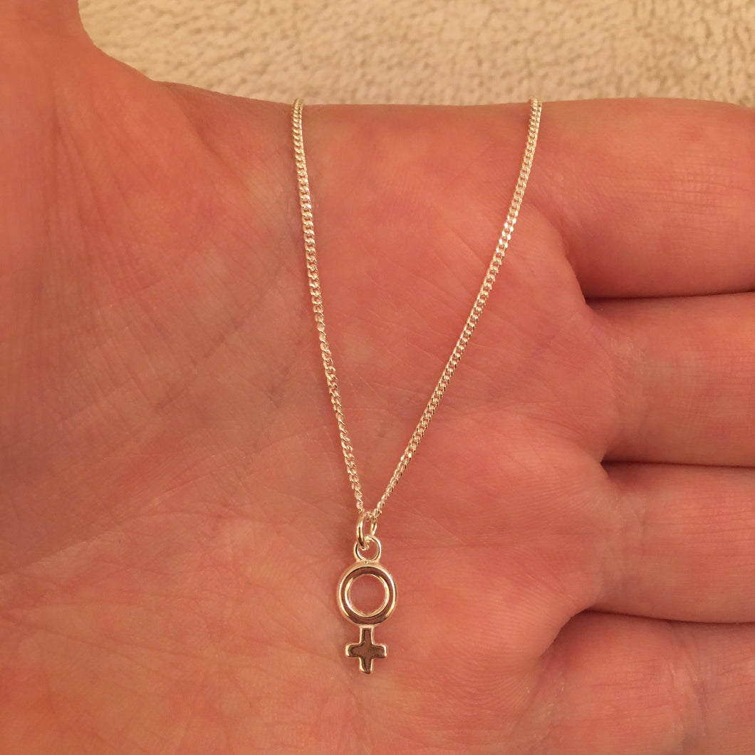 Female symbol necklace